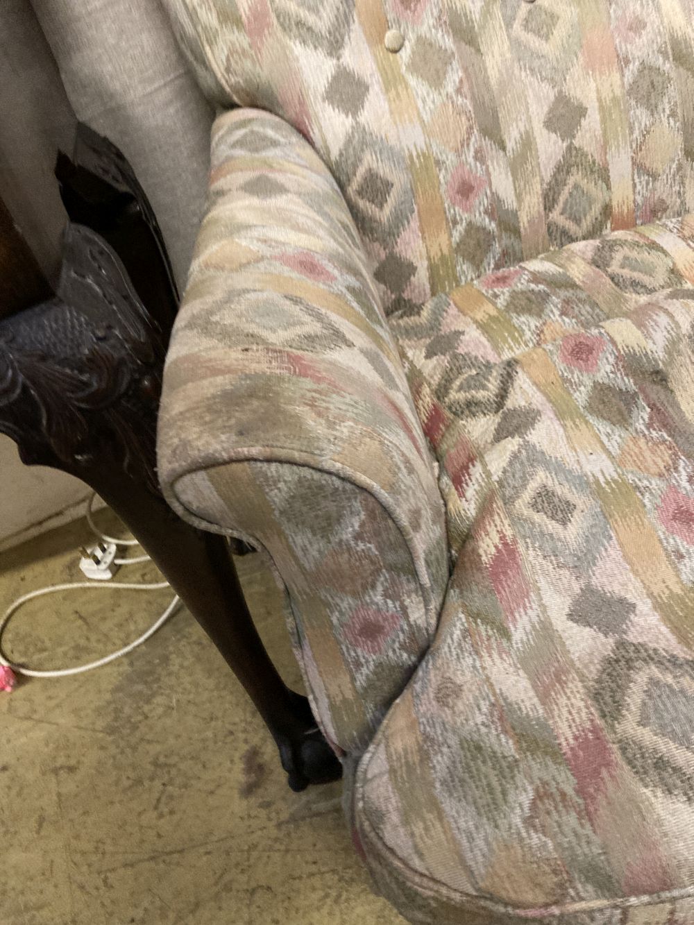 A late Victorian upholstered armchair